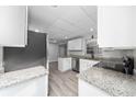 Modern kitchen showcasing granite countertops, stainless steel appliances, and ample cabinet space at 2614 Rio Ln, Orlando, FL 32805