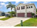Charming two-story home featuring a two-car garage, landscaped yard, and a welcoming facade at 289 Magnolia Park Trl, Sanford, FL 32773