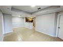 Bright living area showcasing a kitchen and an open-concept layout with tile flooring at 3702 Palm Desert Ln # 5435, Orlando, FL 32839