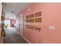 Well-lit hallway featuring stylish wall decor and storage solutions, adding character and functionality at 3759 Collingwood Ln, Oviedo, FL 32765