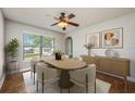 Bright dining room with modern furniture and a view of the outdoors at 4113 Stonefield Dr, Orlando, FL 32826