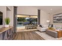 Open-concept living room flows to outdoor area with screened patio and dining at 5259 Quillback Ln, St Cloud, FL 34771