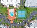 Overhead view of complex pool and tennis courts at 5300 S Atlantic Ave # 6-301, New Smyrna Beach, FL 32169