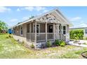 Inviting single-story home with stone accents, cozy porch, and well-kept lawn, perfect for a starter home at 720 N 6Th St, Haines City, FL 33844