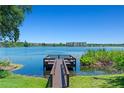 Picturesque lake view from dock featuring waterfront condos in the distance at 1152 Grove St, Maitland, FL 32751