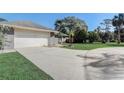 Long and spacious driveway leading to the two-car garage at 1155 Collins Ave, Orange City, FL 32763