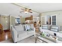 Comfortable living area featuring two sofas and an open concept to the kitchen at 18600 Old Cheney Hwy, Orlando, FL 32820