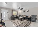 Cozy living room features neutral tones, with a plush sectional sofa and stylish accent rug at 197 Flame Ave, Maitland, FL 32751