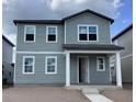 Two-story gray home with multiple windows and covered front porch at 2342 Broadbrook Drive, St Cloud, FL 34771