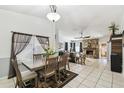 Dining room view into living room with tile floors and lots of natural light at 387 Kantor Blvd, Casselberry, FL 32707
