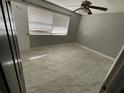 A well-lit bedroom featuring tile floors and a ceiling fan at 434 Diamond Acres Rd, Davenport, FL 33837