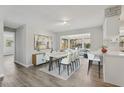 Open concept dining area with stylish table set and bar seating by an adjacent kitchen at 525 Legume Dr, Port Orange, FL 32127