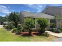 Well-maintained home exterior with manicured lawn and mature landscaping in a tranquil neighborhood at 601 Casa Park Court B Ct, Winter Springs, FL 32708