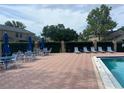 Inviting community pool area with ample seating, perfect for relaxing and enjoying the sunshine at 601 Casa Park Court B Ct, Winter Springs, FL 32708