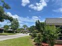 Peaceful street showcasing well-kept homes and lush landscaping in a serene neighborhood at 601 Casa Park Court B Ct, Winter Springs, FL 32708