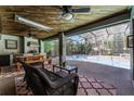 Enclosed patio with an outdoor kitchen featuring a built-in grill, perfect for al fresco dining at 687 Saranac Dr, Winter Springs, FL 32708