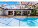 Captivating screened-in pool area with a covered patio, perfect for outdoor entertaining and relaxation at 687 Saranac Dr, Winter Springs, FL 32708