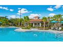 Capture of the sparkling community pool with covered lounging and dining area providing a refreshing retreat at 8001 Cool Breeze Dr # 118, Orlando, FL 32819