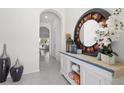 Inviting entryway with stylish console table, decorative mirror, and calming decor at 1121 Blue Jay Dr, Davenport, FL 33837