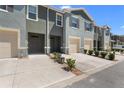 Attractive townhome exteriors with garages, tidy landscaping, and well-maintained surroundings at 1121 Blue Jay Dr, Davenport, FL 33837