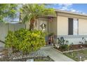Single-story home featuring a cozy front yard with mature trees and a welcoming entrance at 1303 Azalea Way, Winter Garden, FL 34787