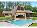 Backyard featuring a sparkling private pool and a spacious patio area perfect for relaxation and entertainment at 14143 Conifer Dr, Orlando, FL 32832
