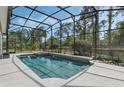 Screened-in pool area with clear water and a jacuzzi, perfect for relaxation and outdoor enjoyment at 1570 Westover Loop, Lake Mary, FL 32746