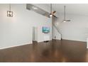 A very open living room with hardwood floors and neutral color palette at 2565 Albion Ave # 2, Orlando, FL 32833
