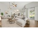 Spacious living room open to the kitchen, features modern decor and ample natural light at 2565 Albion Ave # 2, Orlando, FL 32833