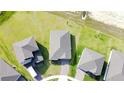 Overhead view of home in a community, showcasing the roof and surrounding green space at 264 Towns Cir, Haines City, FL 33844