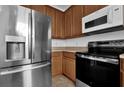 Kitchen features stainless steel refrigerator and oven at 3462 Allegra Cir, St Cloud, FL 34772
