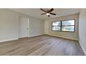 Bedroom with light laminate flooring, fresh paint and a ceiling fan at 4510 Ravinnia Dr, Orlando, FL 32809