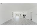 Bright, spacious living room with sleek floors and an open floor plan at 741 Marion Oaks Ln, Ocala, FL 34473