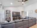 Spacious living room with high ceilings, recessed lighting, and comfortable seating area at 1296 Gage Ave, Deltona, FL 32738