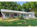 Charming single-story home with lush landscaping at 2132 Rouse Lake Rd, Orlando, FL 32817