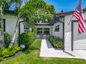Inviting entrance with meticulously maintained landscaping, creating a warm, secure entry at 2817 Prince John Rd, Winter Park, FL 32792
