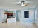Open-concept living area with tile flooring and easy access to the kitchen, creating a welcoming space at 3461 Home Town Ln, St Cloud, FL 34769