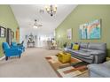 Open-concept living room and dining area with neutral tones and ample natural light at 6147 Sunnyvale Dr # Ge, Orlando, FL 32822