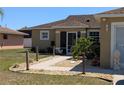 A welcoming home boasting a landscaped front yard, lovely rock garden, and a cozy porch entrance at 712 Leonardo Ct, Kissimmee, FL 34758