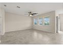 Spacious living room featuring tile floors, a modern ceiling fan and a natural light at 8991 Fluffy Lie Ct, Davenport, FL 33896
