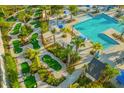 Fun mini golf course surrounded by lush landscaping and palm trees, offering a great outdoor activity at 8991 Fluffy Lie Ct, Davenport, FL 33896