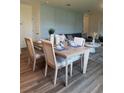 Cozy dining room featuring a modern table set, a decorative wall, and comfortable seating at 987 Commons Way, Port Orange, FL 32129