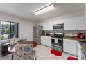 Bright kitchen with stainless steel appliances and a cozy eat-in area at 11 Escondido Cir # 110, Altamonte Springs, FL 32701