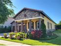 Beautiful exterior view of a well-maintained home with manicured lawn and landscape at 15707 Cutter Sail Pl, Winter Garden, FL 34787