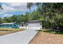 Attractive single-story home featuring a two-car garage and fresh landscaping for enhanced curb appeal at 1819 Carr St, Deland, FL 32720