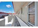 Exterior walkway of a condominium with a view of the parking lot at 2901 N Halifax Ave # 220, Daytona Beach, FL 32118