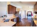 Well-lit kitchen featuring stainless steel appliances, wood cabinets, and durable countertops at 1054 Windswept Ct, Ocoee, FL 34761