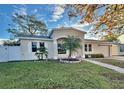Charming home with well-manicured lawn and landscaping at 145 Burns Ave, Longwood, FL 32750