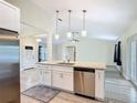Spacious kitchen features a large island with granite countertops and stainless steel appliances at 2984 Monica Ter, Kissimmee, FL 34744