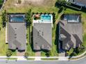 Aerial view of neighborhood homes showing private pools and backyard spaces at 327 Island Sound Ct, Longwood, FL 32779